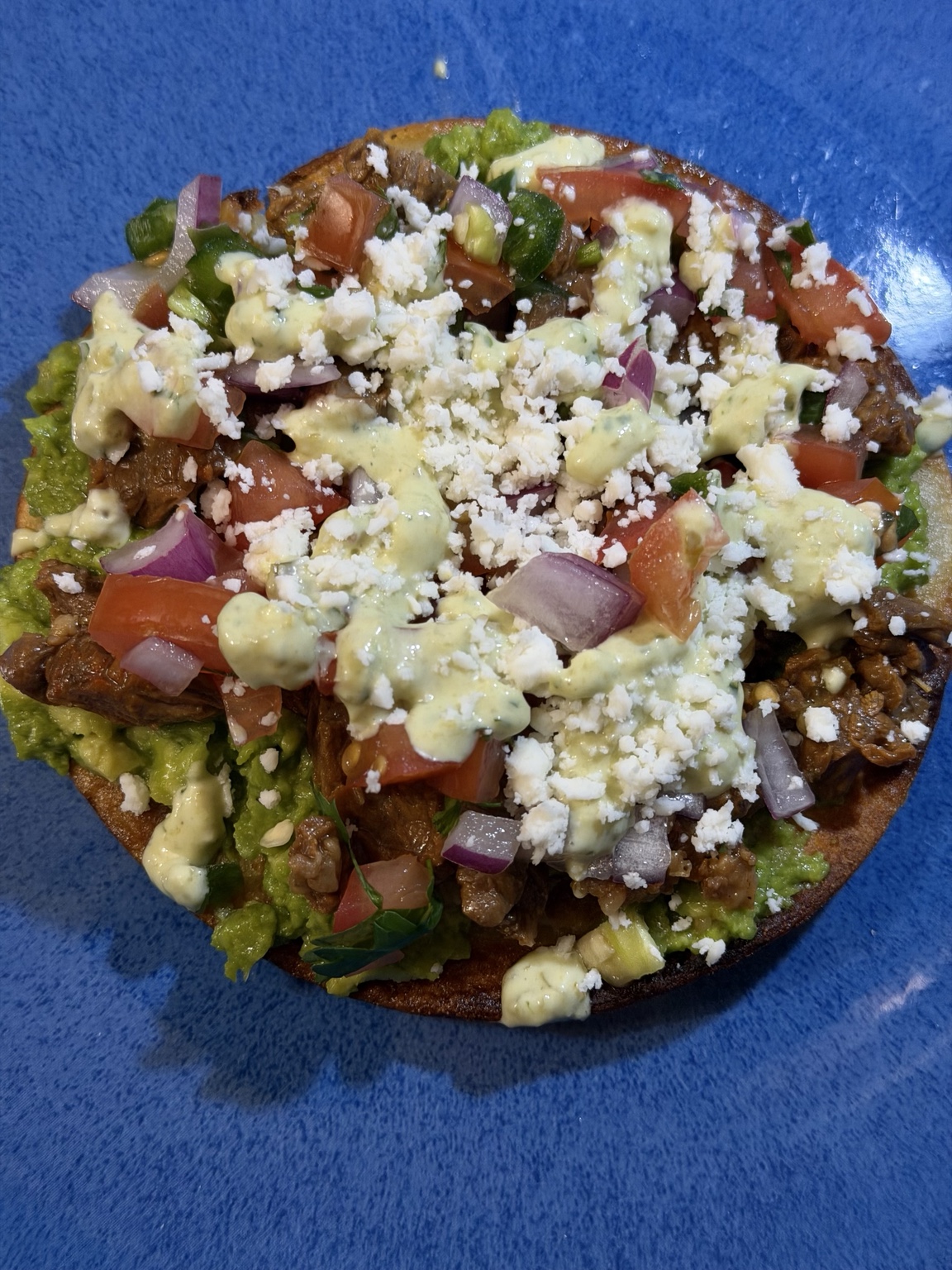 Crystal’s homemade steak tostada with avocado, pico de gallo and creamy jalapeño sauce